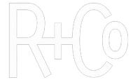 A white line drawing of the letters r and c on a white background.