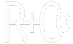 A white line drawing of the letters r and c on a white background.