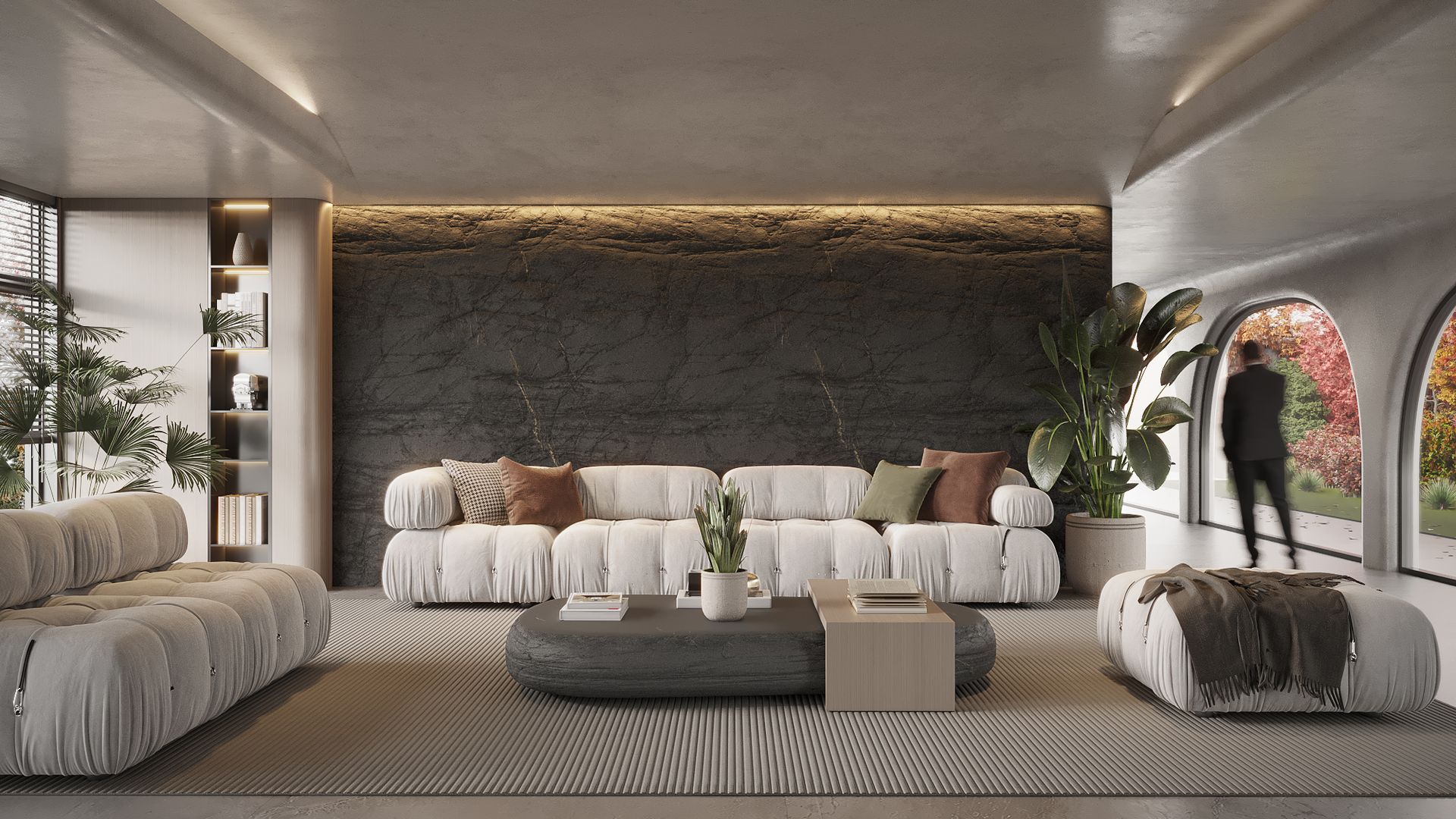 Modern living room with white sofas, patterned rug, and arched windows.