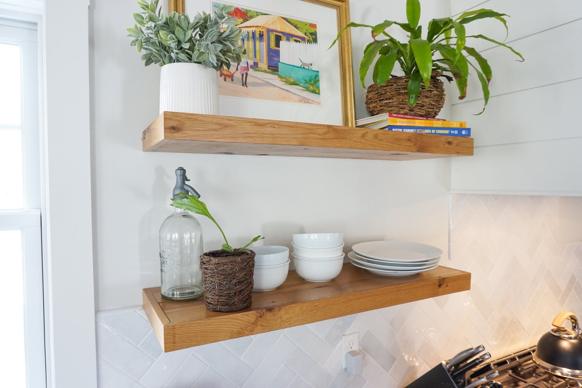 a kitchen shelf has a picture of a house on it