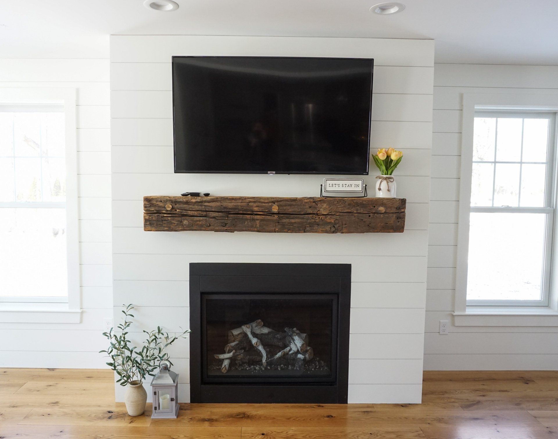 A fireplace with a flat screen tv above it