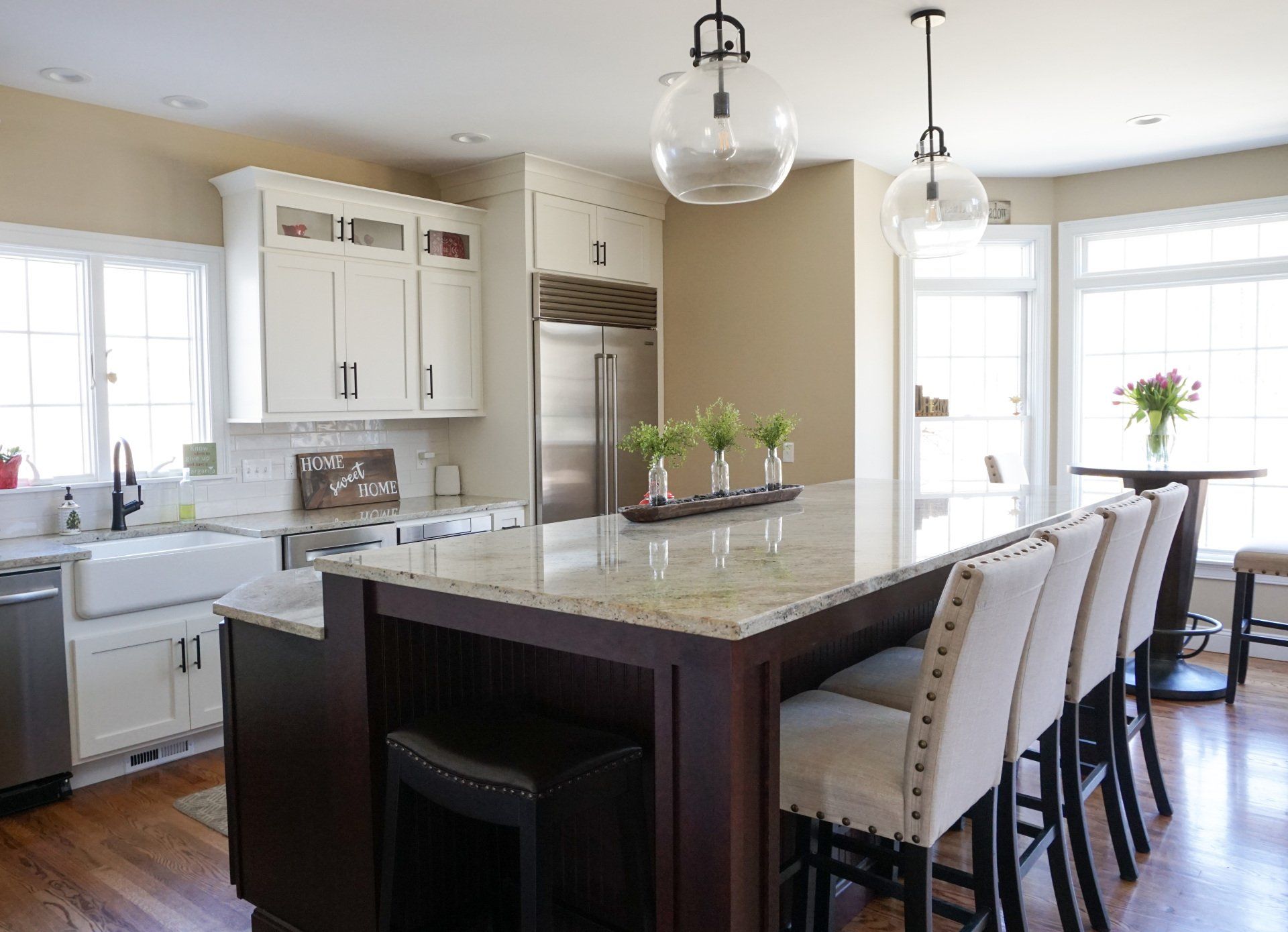 a kitchen with a sign that says home sweet home