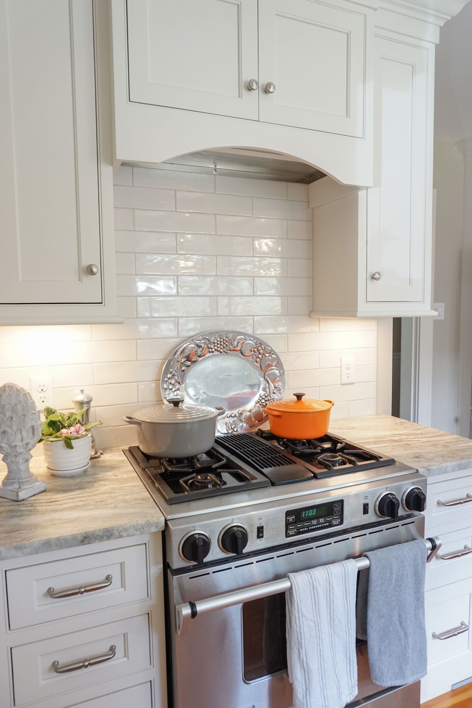 a stainless steel stove with a digital display that reads 10:08