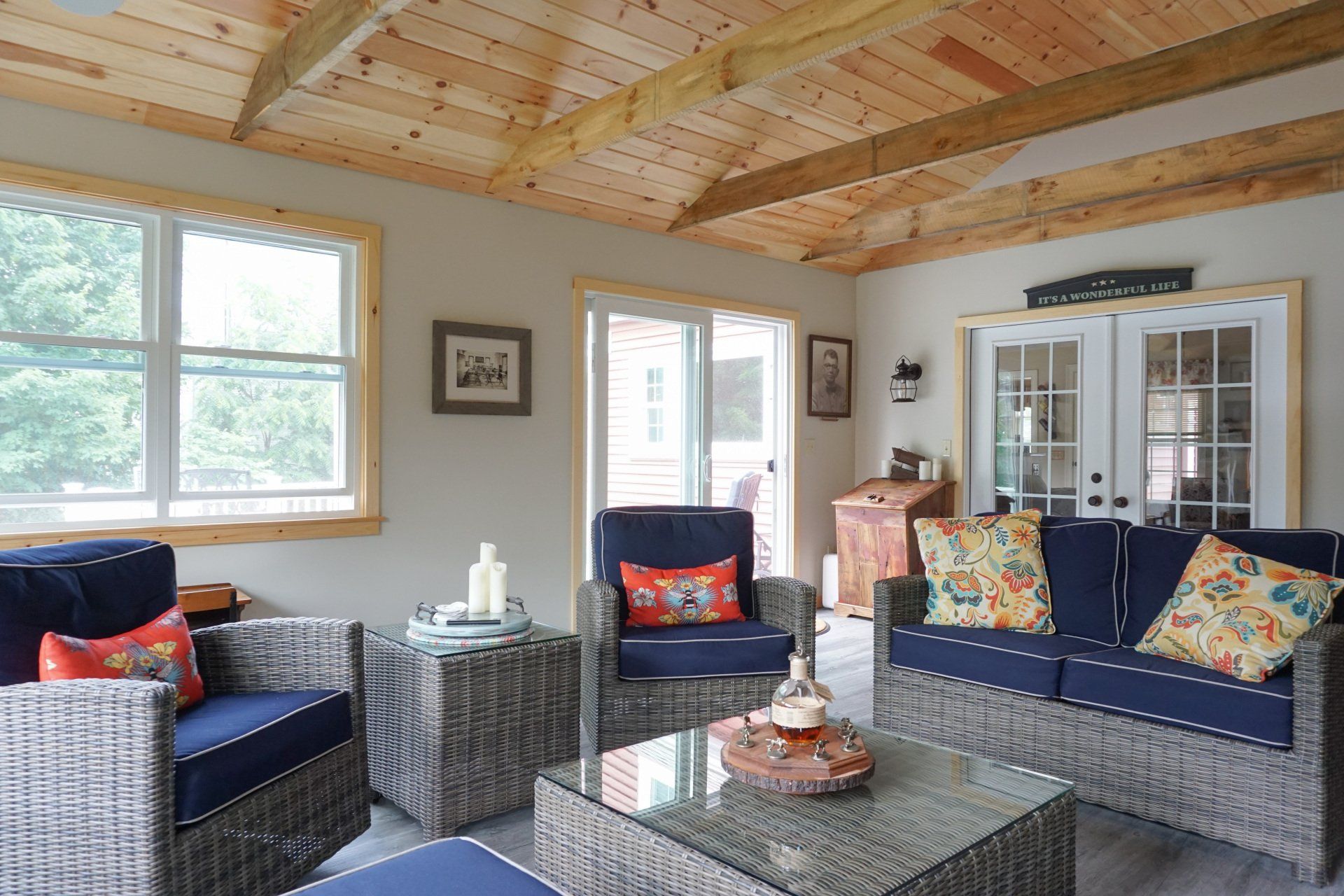 A living room with a couch , chairs and a table