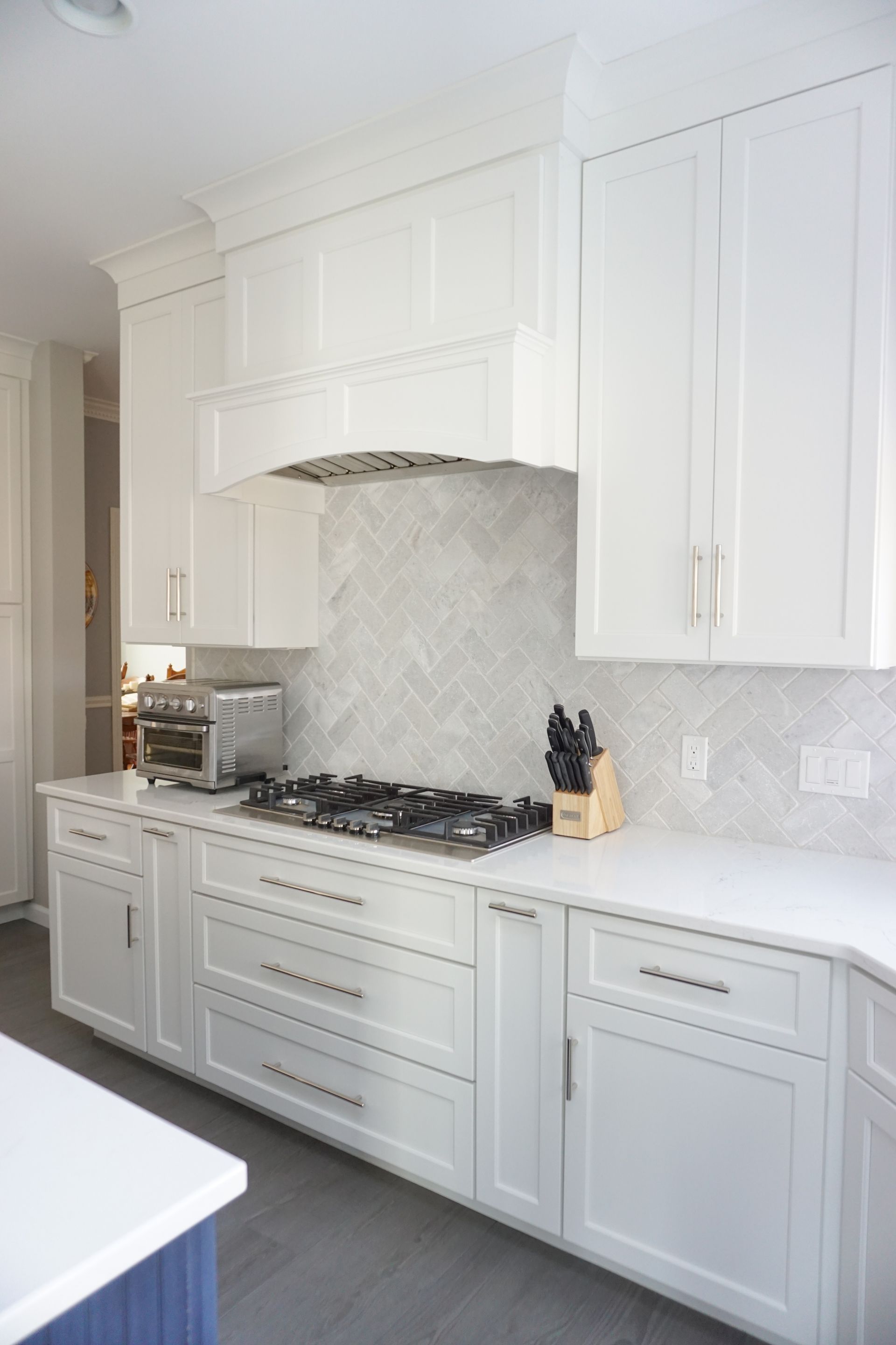 new kitchen remodel in Western MA with white cabinets and a stove top oven