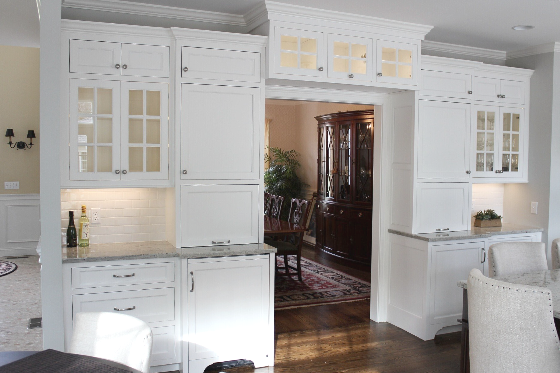 a bottle of wine sits on a counter in a kitchen