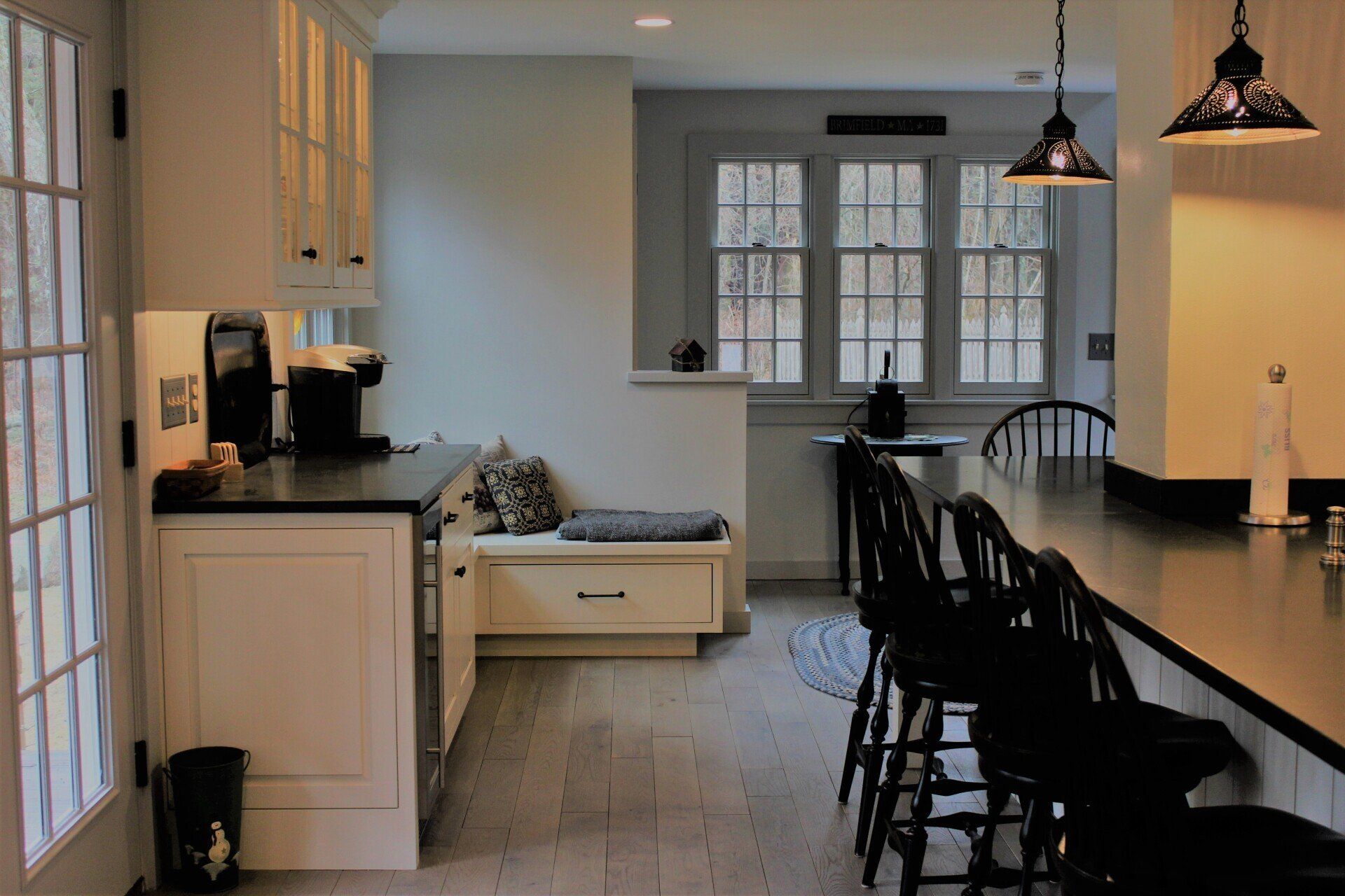 a kitchen with a sign on the wall that says 