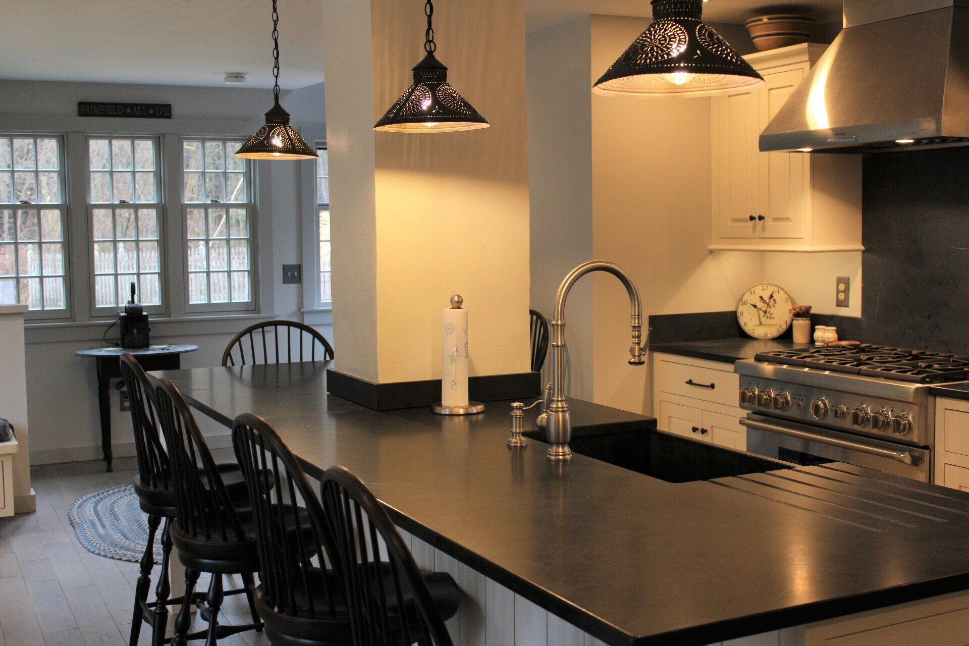 a kitchen with a sign on the wall that says 