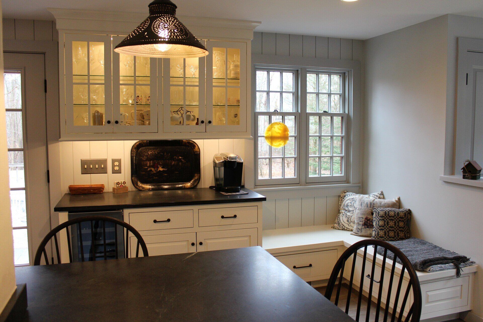 a kitchen with a sign on the wall that says 
