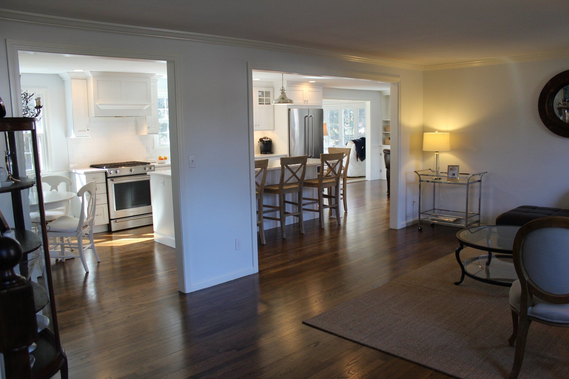 a living room leading to a kitchen and dining room