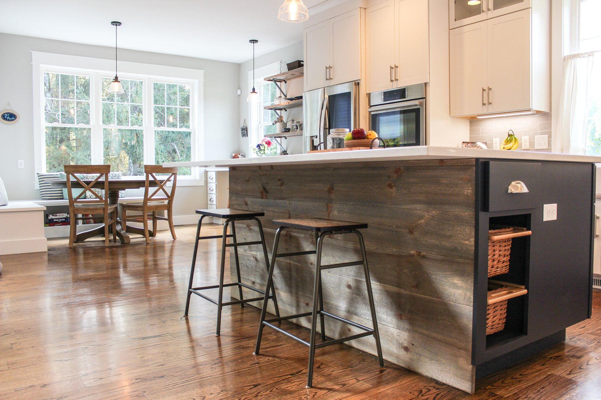 a kitchen with a wooden island and stools