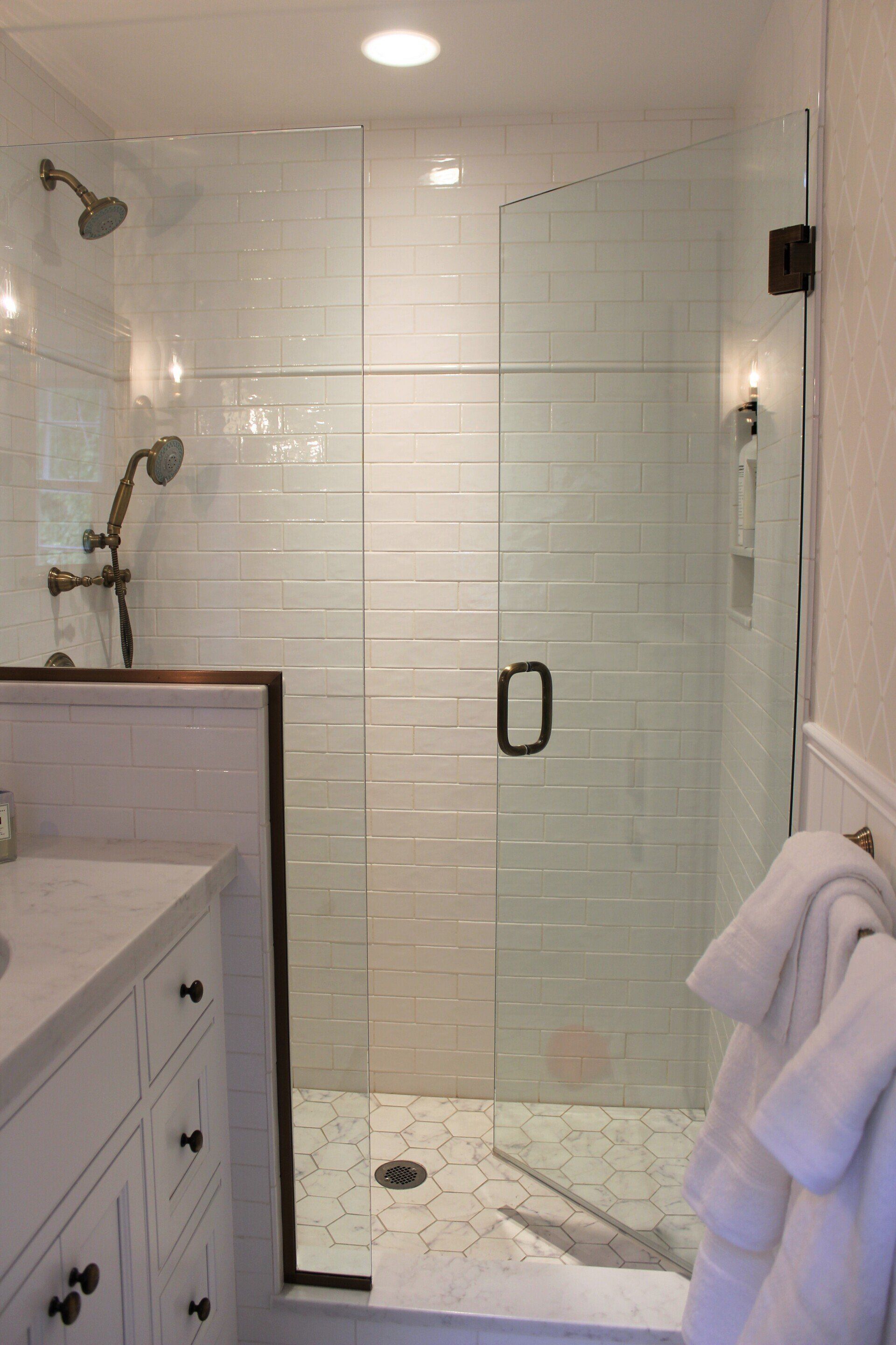 beautiful bathroom renovation in West Springfield with half wall, glass wall and glass shower walk in door
