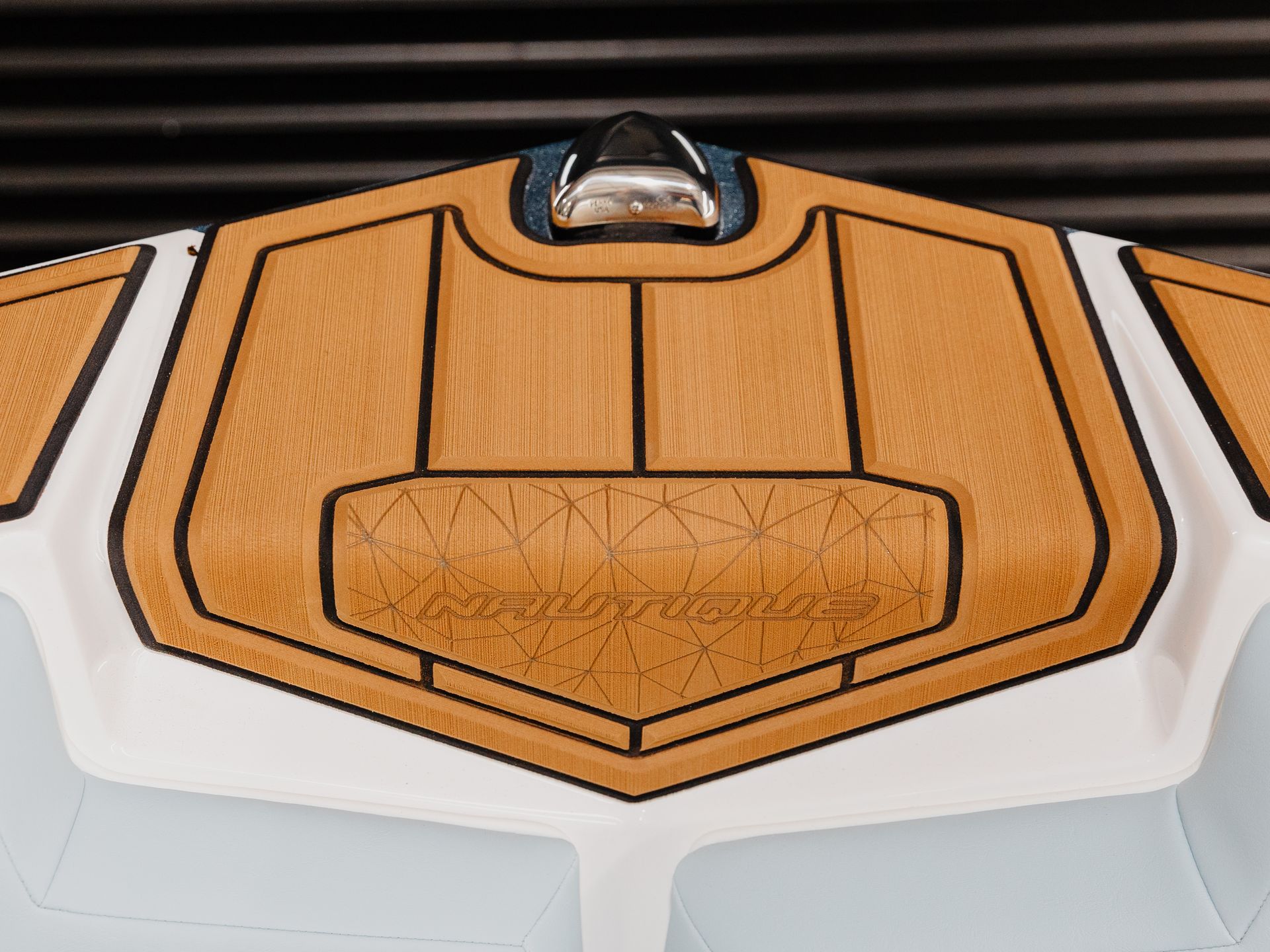 A close up of a boat with a wooden deck