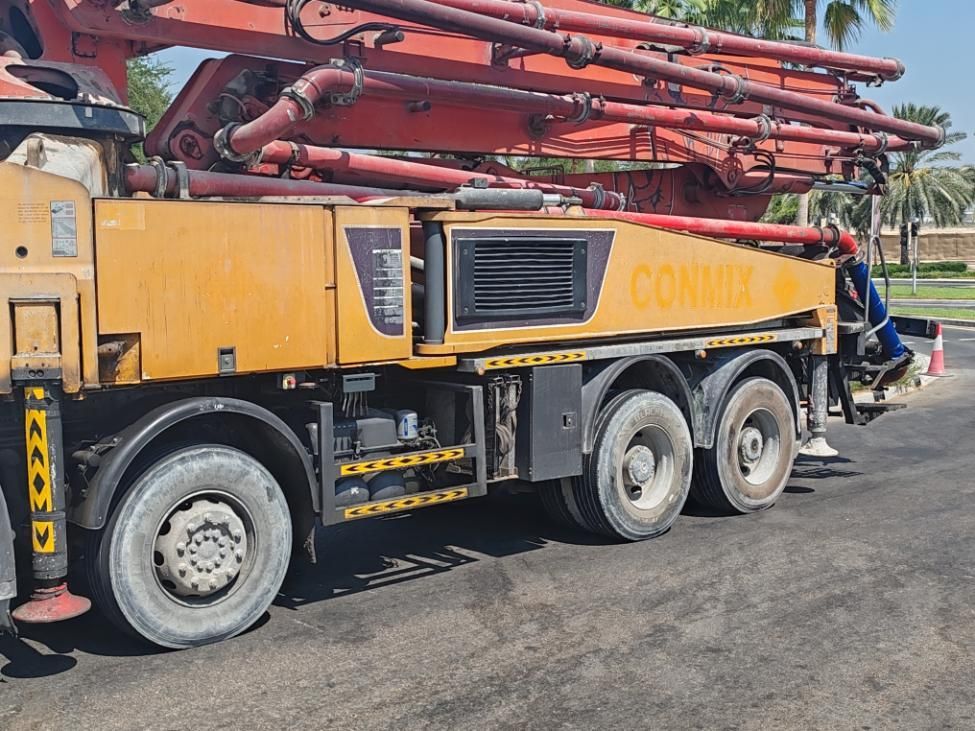 A Concrete Pump Truck Is Parked On The Side Of The Road — New England & North West Concrete Pumping In Uralla, NSW