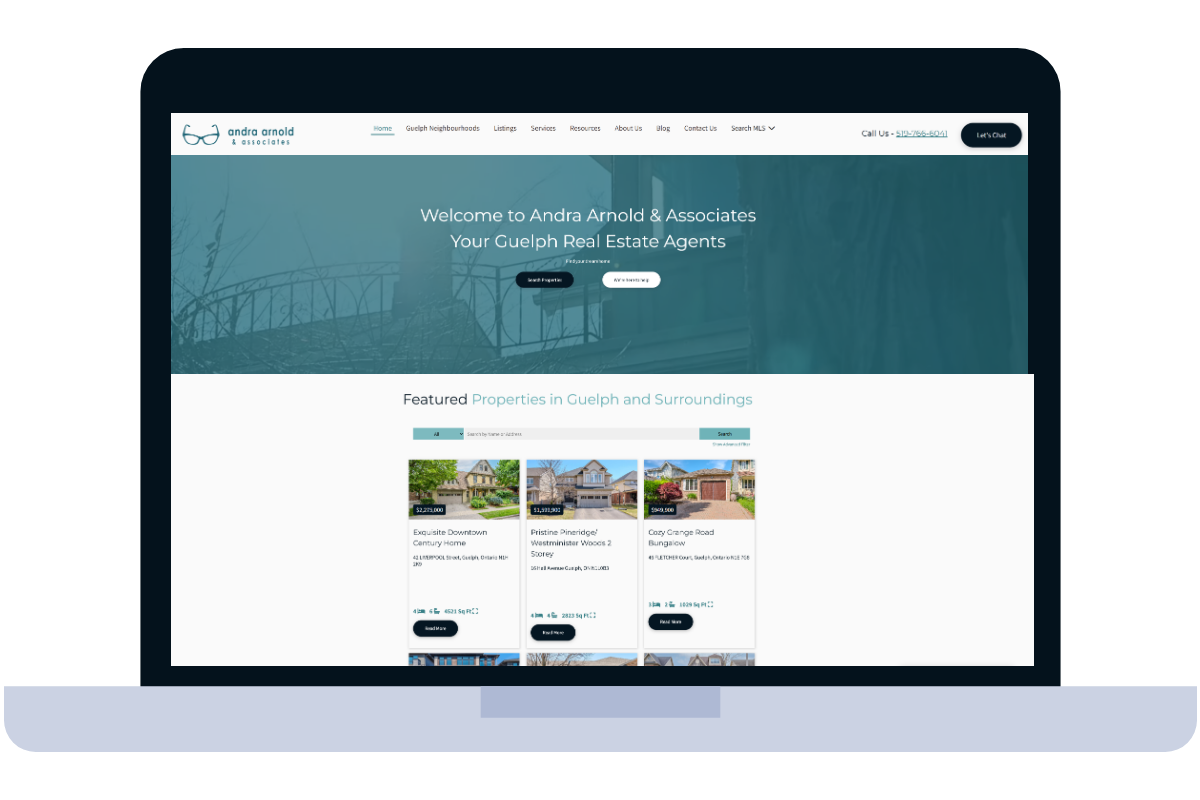 Laptop displaying a real estate website showcasing featured properties.