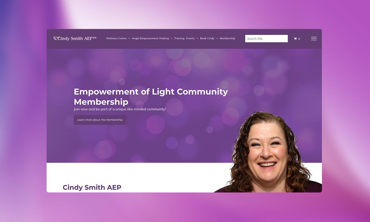 A woman is smiling on the homepage of a website.