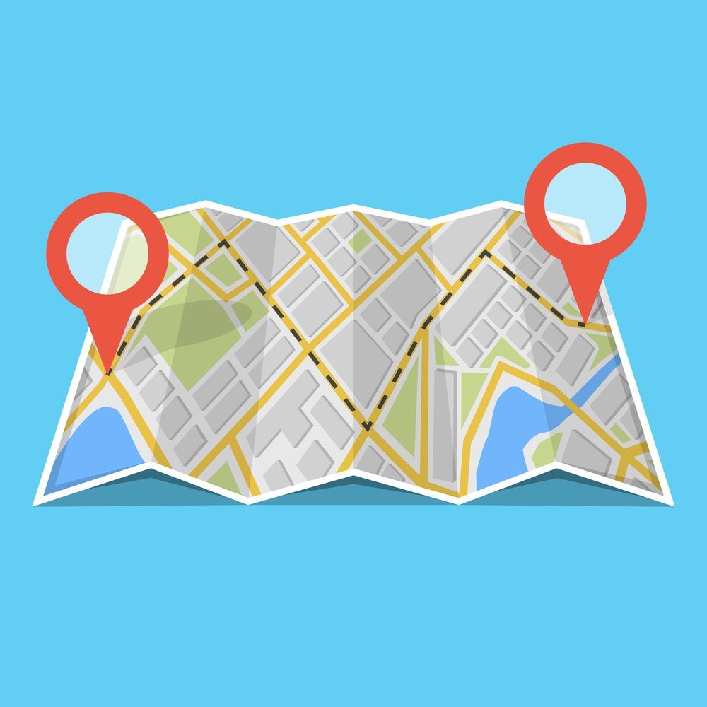 Folded map with two red location markers.