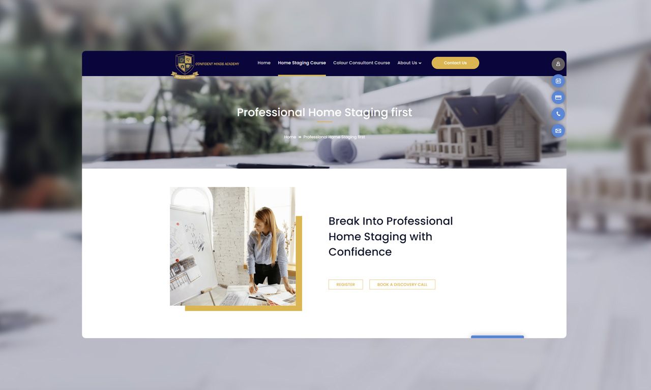 A woman is standing in front of a model house on a website.