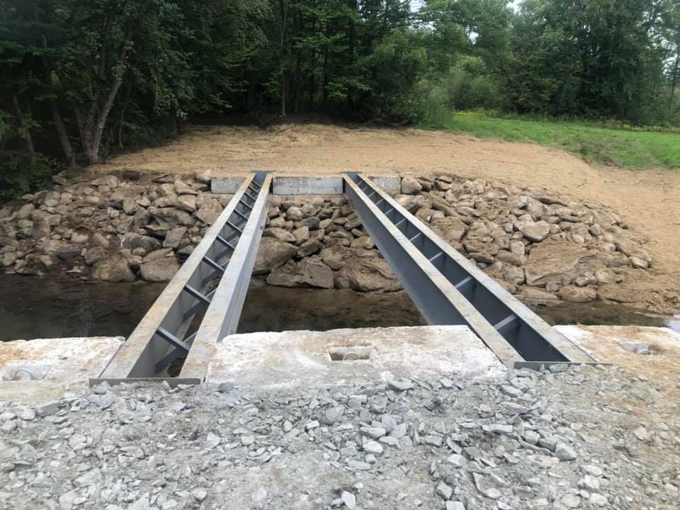 A bridge is being built over a river.