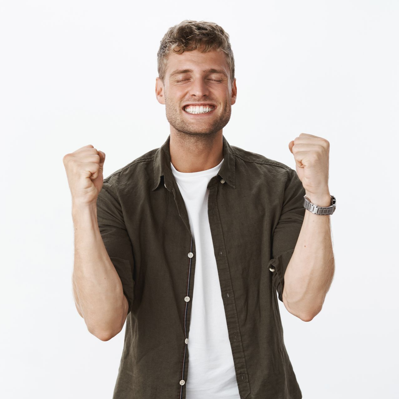 Man with closed eyes, smiling, arms raised with fists clenched in celebration. Man with closed eyes, smiling, arms raised with fists clenched in celebration.