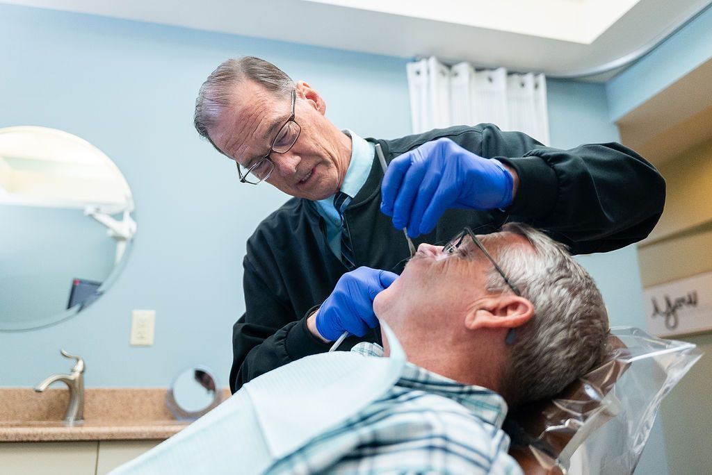 Dr. Robert Lantzy performing a dental exam at Robert A. Lantzy DMD, Cleanings & Exams in Newtown, PA