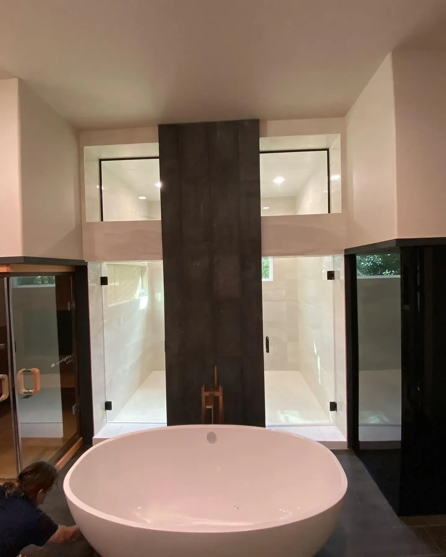 A bathroom with a large bathtub and a walk in shower