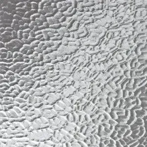 A close up of a piece of glass with a snakeskin pattern.