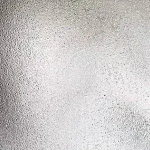 A close up of a white surface with a grainy texture.