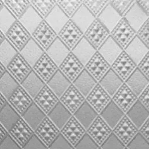 A close up of a white surface with a pattern on it.