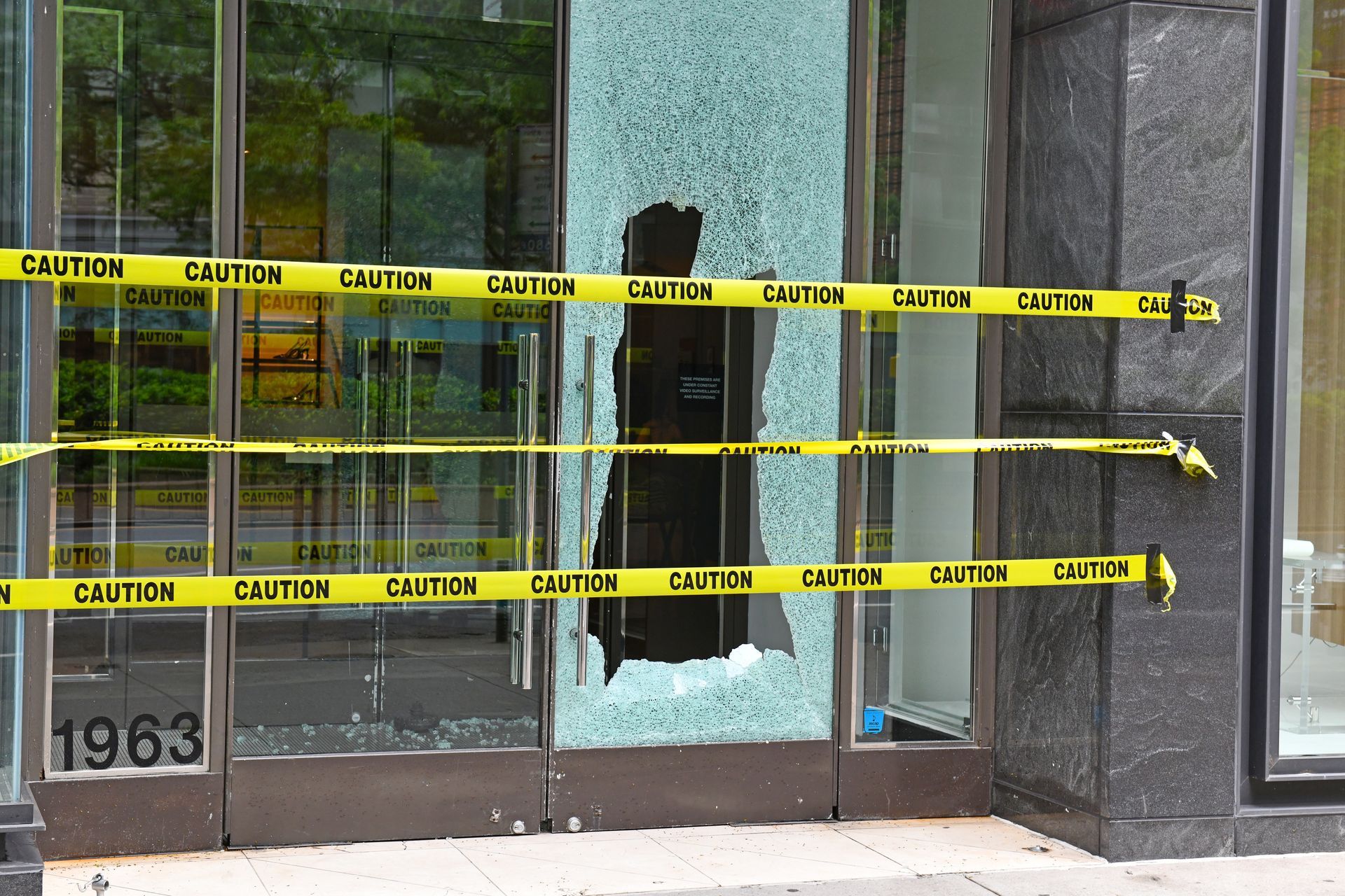 A close up of a broken window on a building.