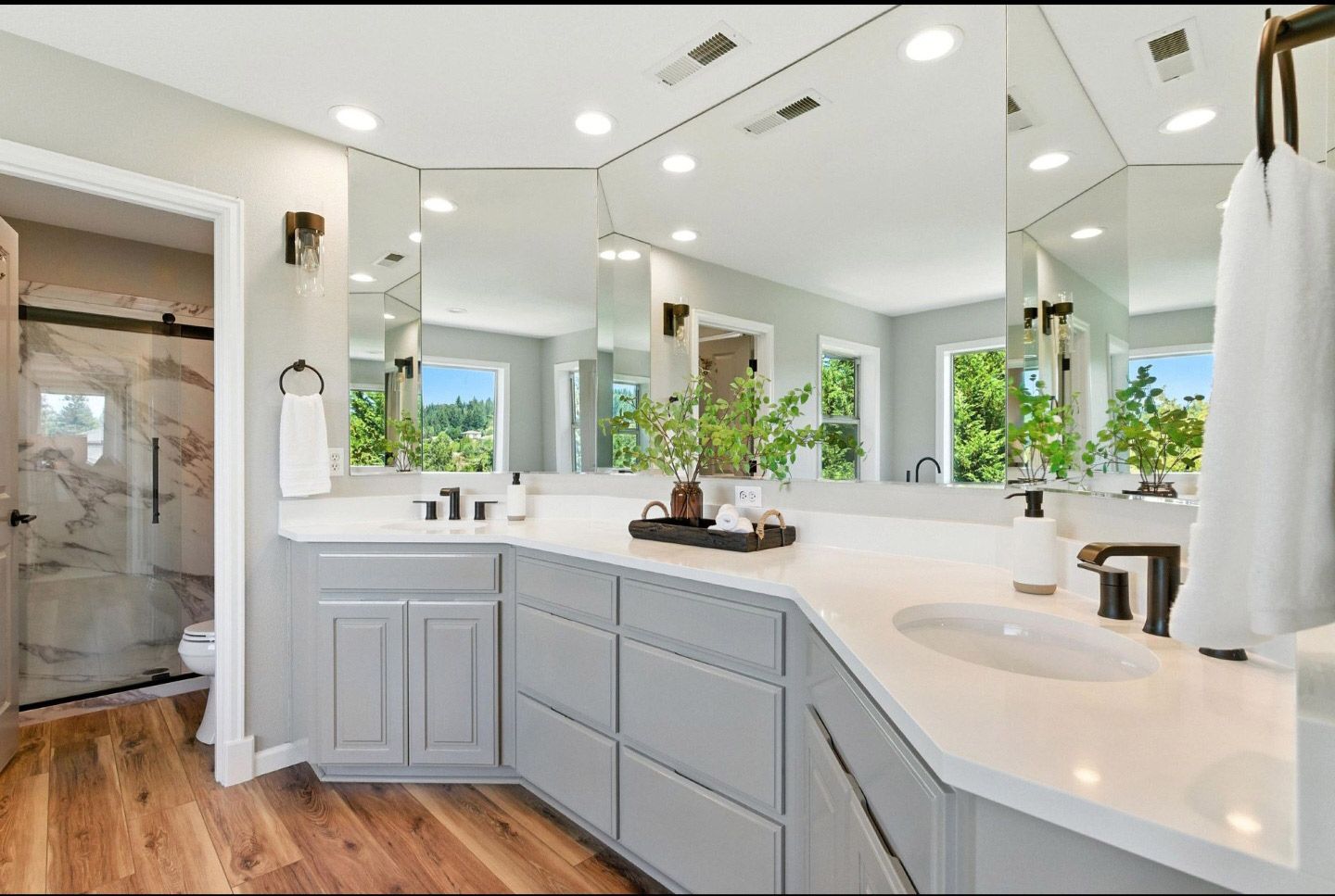 Bathroom with white vanity and countertops