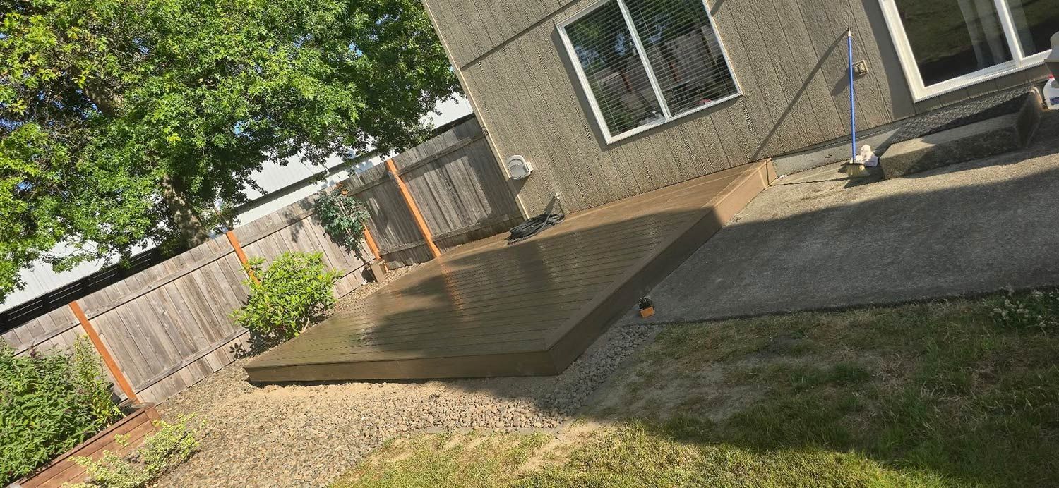 Wooden fence and deck in backyard