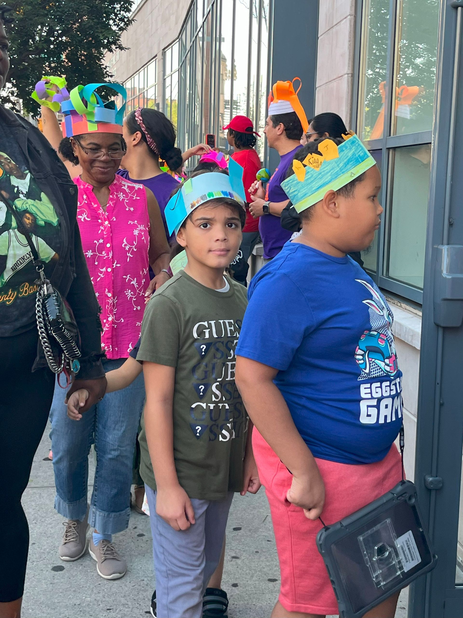 A boy wearing a blue shirt that says gamer on it