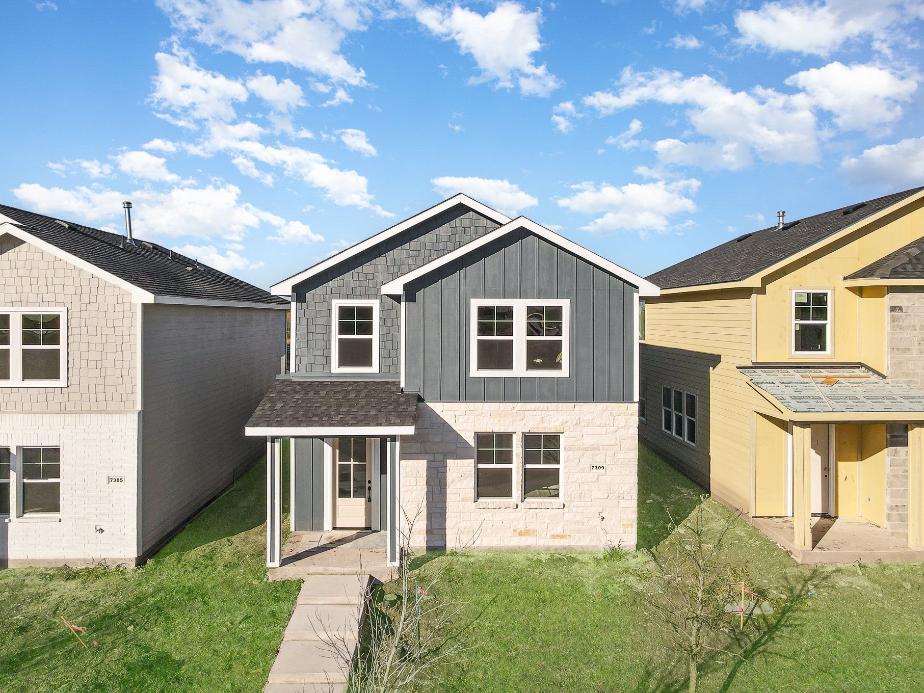 An aerial view of a row of houses in a residential area.