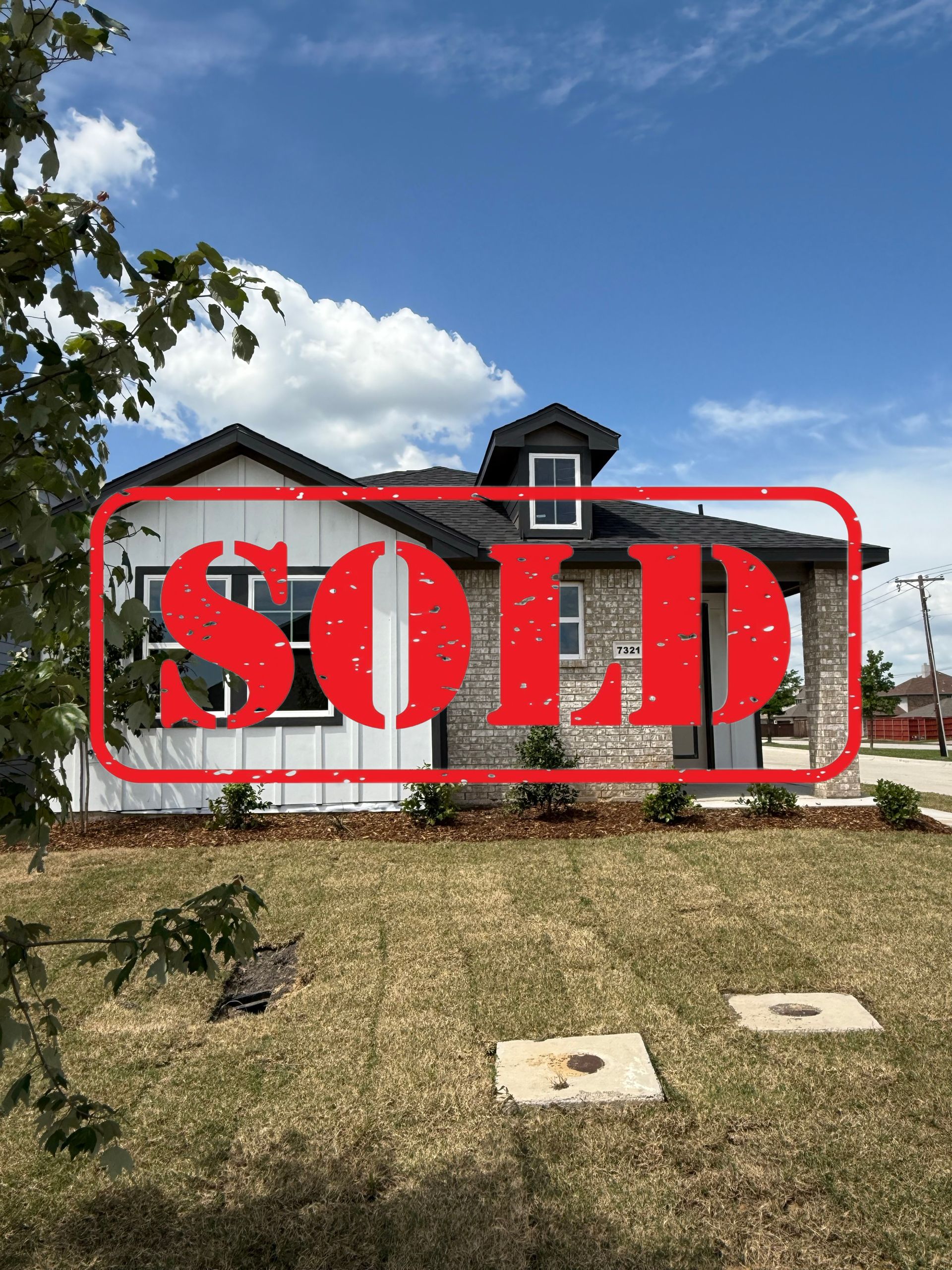 An artist 's impression of a house with a black roof and white siding.