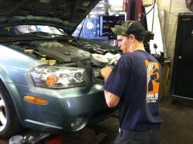 Man repairing a car — auto repair Bethel Park, PA