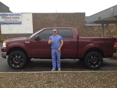 Man standing beside a car — auto repair Bethel Park, PA