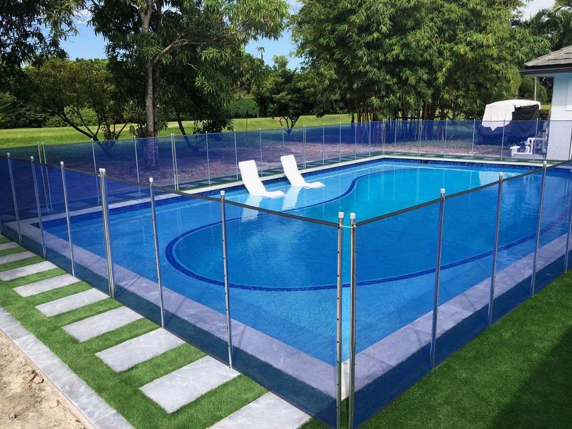 a large swimming pool with a fence around it