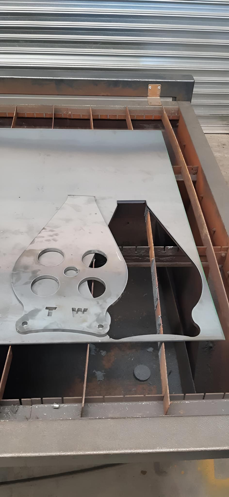 Piece of Metal is Being Cut on a Machine — Turnweld Engineering in Coolum Beach, QLD