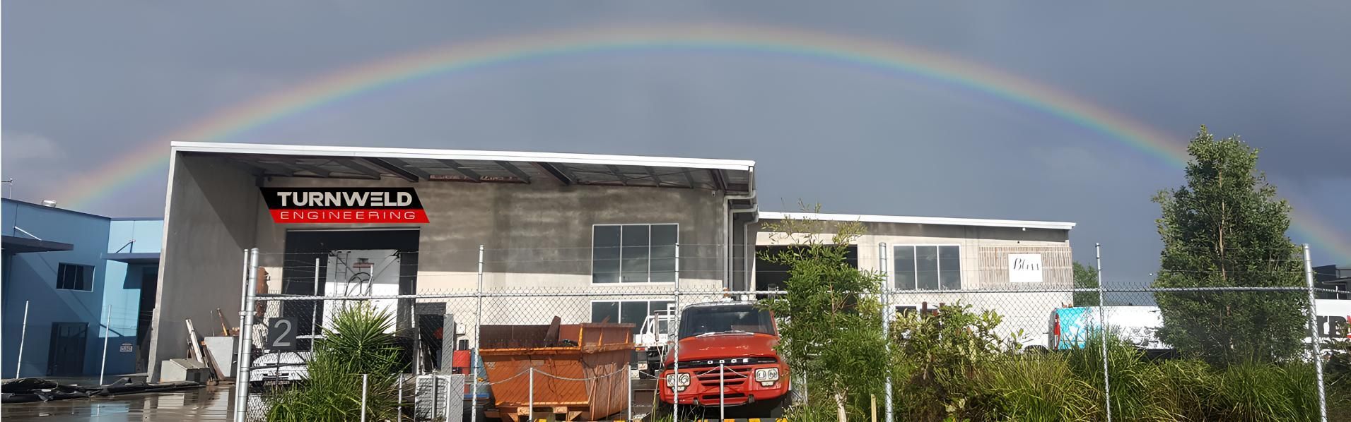 Building With a Rainbow in the Sky Above It — Turnweld Engineering in Coolum Beach, QLD