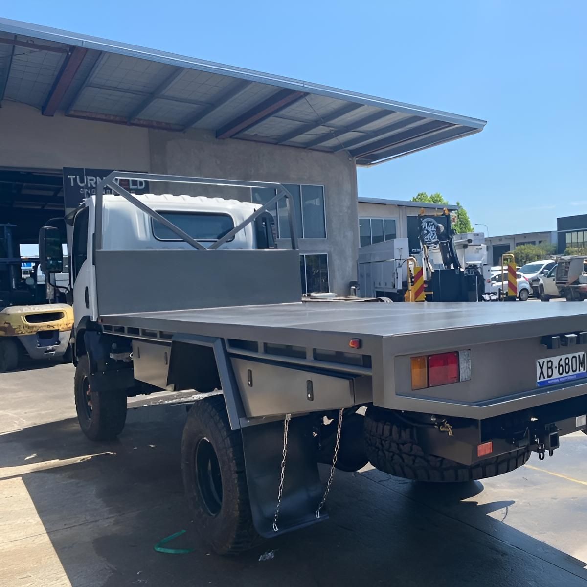Flatbed Truck is Parked in Front of a Building — Turnweld Engineering in Coolum Beach, QLD
