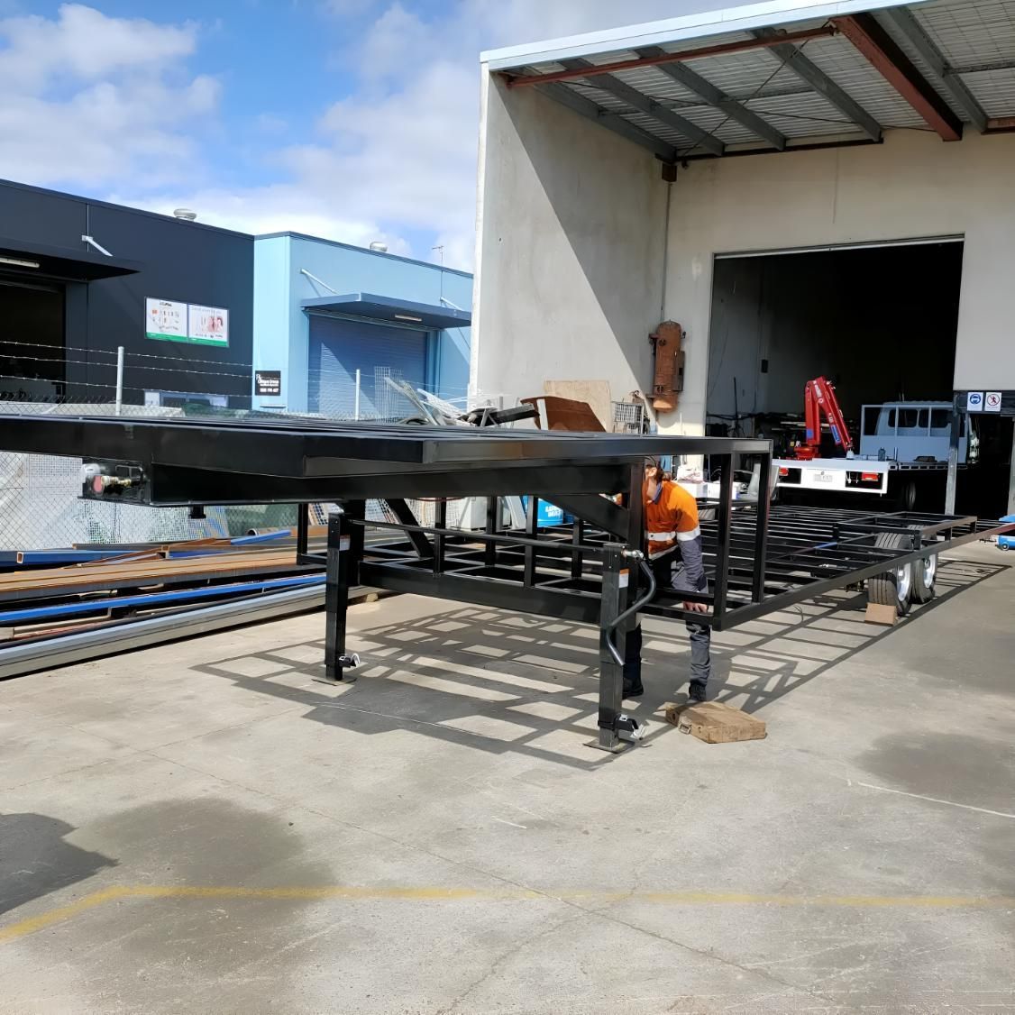 Man is Working on a Metal Structure in Front of a Building — Turnweld Engineering in Coolum Beach, QLD