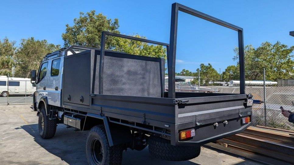 A Truck With a Tray Bed is Parked in a Parking Lot — Turnweld Engineering in Coolum Beach, QLD