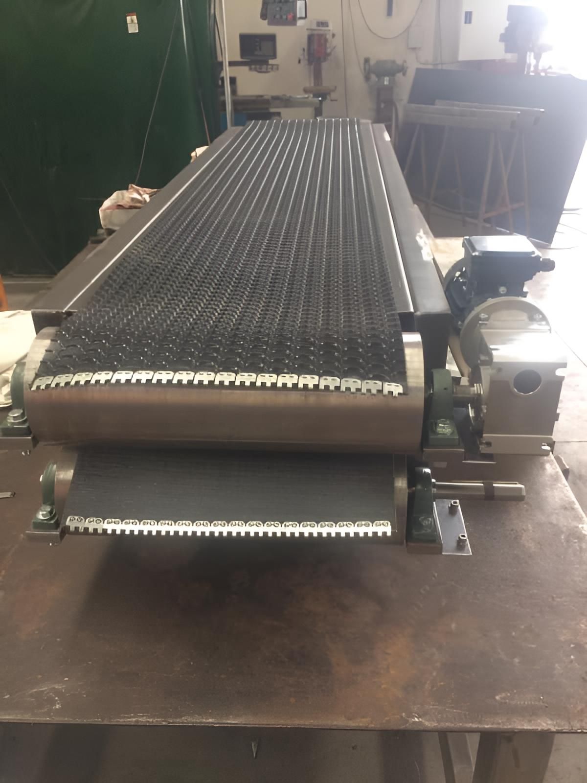 Conveyor Belt is Sitting on Top of a Metal Table — Turnweld Engineering in Coolum Beach, QLD