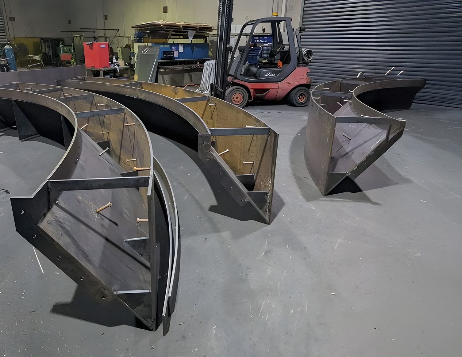 Metal Fabrication Shop, With Steel Boat Parts On The Floor