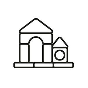 A house built from toy blocks, with an arched doorway and a small tower.