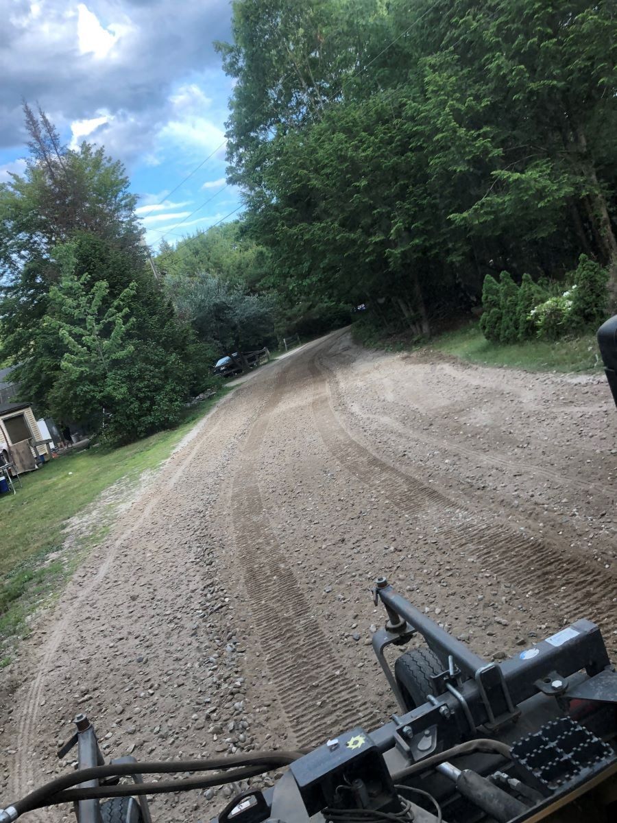 Repairing dirt road in Maine