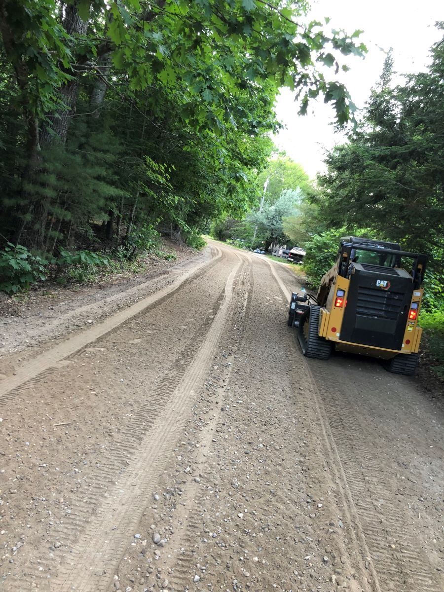 Repairing dirt road in Maine