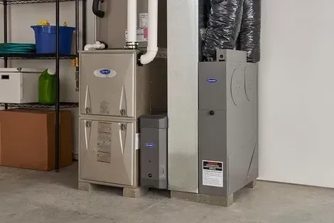 Furnace system with ductwork in a basement setting.