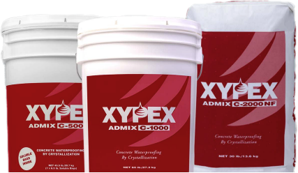 Three containers of Xypex concrete waterproofing: two buckets and one bag, all with red and white labels.